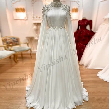 Очарователна сватбена рокля Булчински рокли Дълги ръкави Високо деколте 3D цветя Апликационни перли Шифон A Line булката рокли Кейп